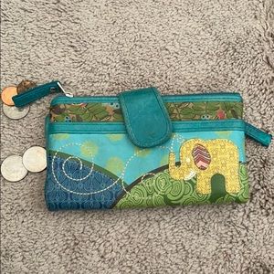 Fossil leather wallet with elephant design